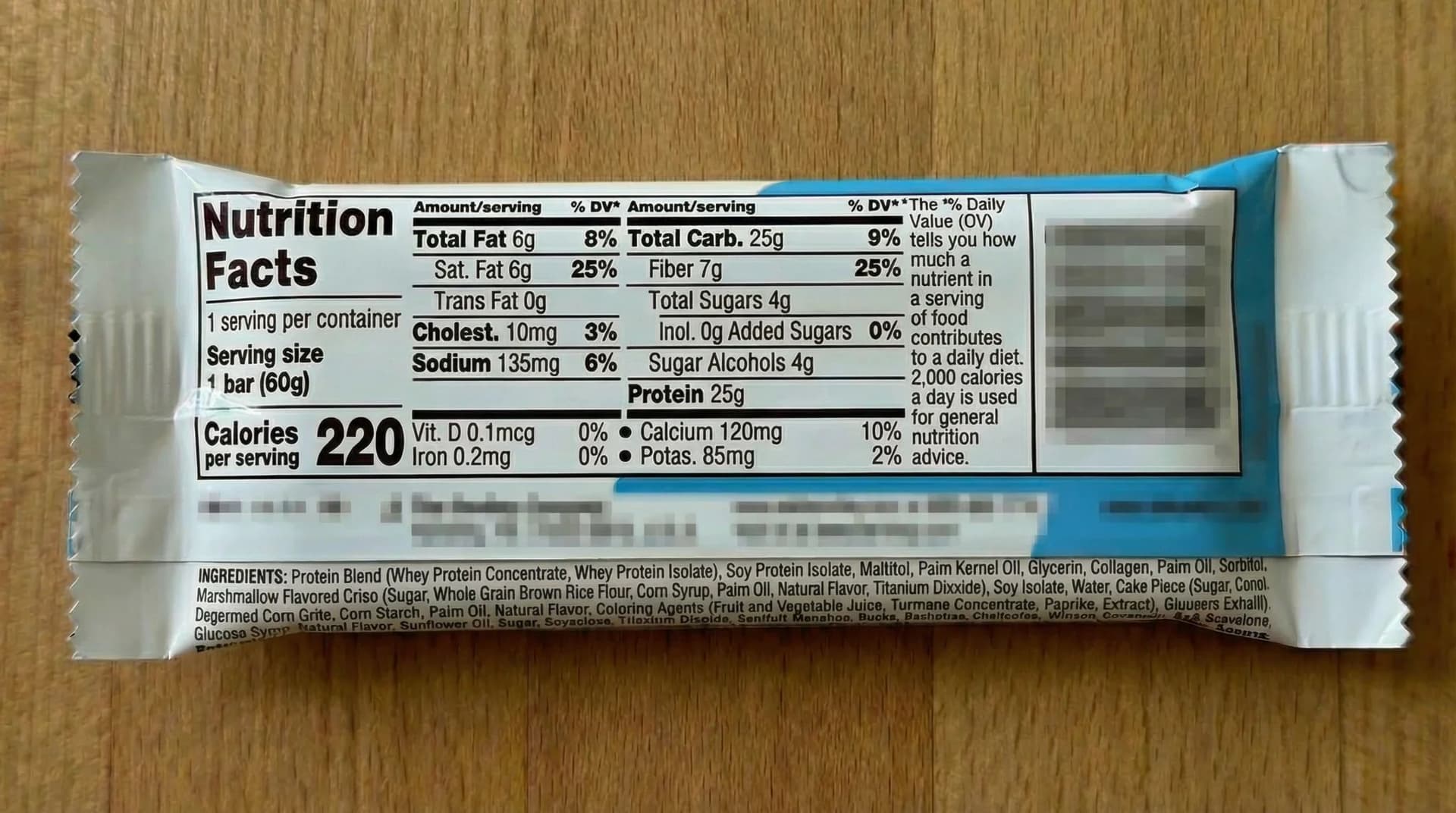 Nutrition facts and ingredient list on the back of a protein bar wrapper